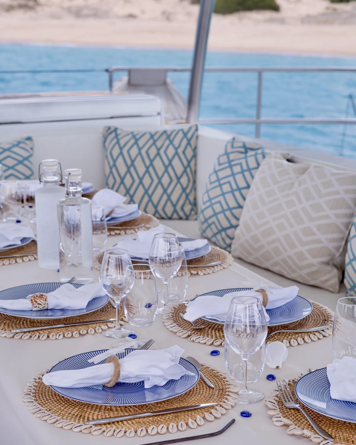 Lunch table set by the sea on One Planet